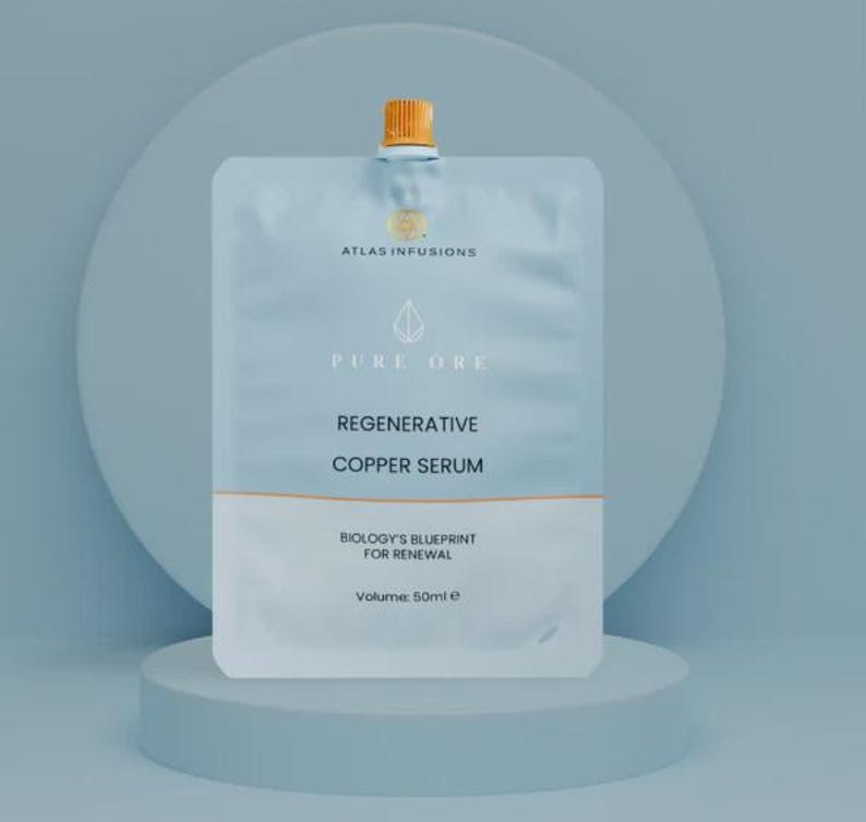 May include: A light blue pouch of "Regenerative Copper Serum" with the text "Pure Ore" and "Atlas Infusions". The pouch has a white bottom section and a gold-coloured cap. The volume is 50ml.