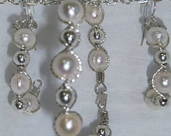 Large baroke pearl bracelet and earrings.