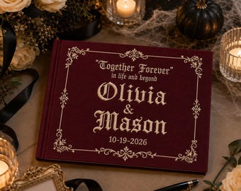 May include: A deep burgundy velvet-covered guest book featuring gold embroidered text that reads Together Forever in life and beyond, Olivia & Mason, and the date 10-19-2026, framed by an ornate gold filigree border on the front cover.
