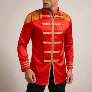 May include: A bright red long-sleeve jacket featuring a high collar, gold-toned metallic buttons, and decorative gold braided trim across the front. The shoulders are accented with gold fringe epaulets, and the cuffs feature matching gold trim.