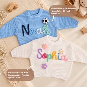 May include: A light blue knit sweater with the name Noah in dark blue, light blue, and green yarn, plus a soccer ball patch. A white knit sweater with the name Sophia in purple, pink, green, yellow, and blue yarn, plus three flower patches.