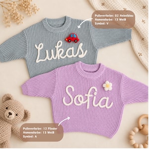 May include: Two long-sleeved knit sweaters with crew necks. The top sweater is light blue with the white text 'Lukas' and a red car patch. The bottom sweater is light purple with the white text 'Sofia' and a white flower patch.