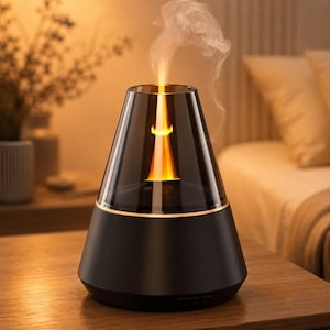 May include: A conical aroma diffuser with a matte black base and a translucent dark gray glass top. The device emits a bright orange flame-like light effect from the center, accompanied by a thin, wispy trail of white mist rising from the top opening.
