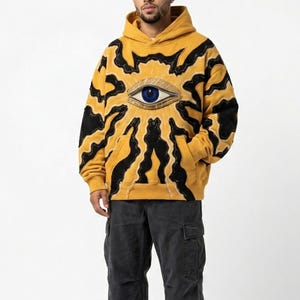 Sudadera con capucha Mystic Eye, jersey con estampado de retazos Sunburst, sudadera urbana, moda callejera, unisex de talla grande.