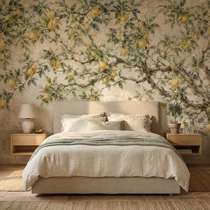 May include: A bedroom featuring a large wall mural of a lemon tree with yellow fruit and green leaves on a textured off-white background. The room includes a beige upholstered bed, two light wood floating nightstands, and a wooden dresser.