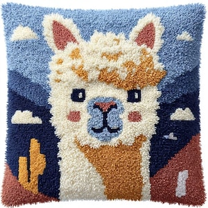 May include: A square throw pillow featuring a textured punch needle design of a cream-colored llama against a desert landscape. The background includes a blue sky with white clouds, a dark blue mountain range, and a yellow cactus on a terracotta ground.