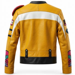 May include: A mustard yellow leather jacket featuring a black collar, a horizontal white stripe across the back, and a black hem with two snap-button tabs. The sleeves include red, teal, and white graphic accents, with patches on the shoulders.