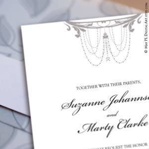 May include: A white invitation card with elegant gray decorative elements at the top. The text reads "Together with their parents, Suzanne Johannse and Marty Clarke". The design is suitable for weddings or formal events.