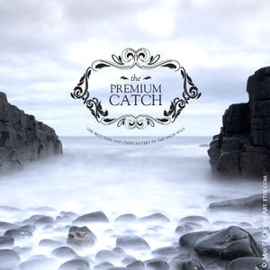May include: A scenic image of a rocky coastline with the text "the PREMIUM CATCH" in a decorative frame. The text below reads "THE BEST FISH AND CHIPS EATERY IN THE HIGH SEAS". The image has a soft, blurred effect, with the sea and sky blending together.