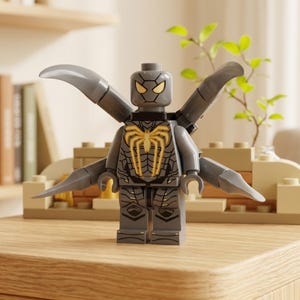 May include: A gray Lego figure with a spider emblem on the chest and yellow eyes. The figure has articulated arms and legs and is wearing a gray, articulated wing apparatus. The figure is standing on a wooden surface.