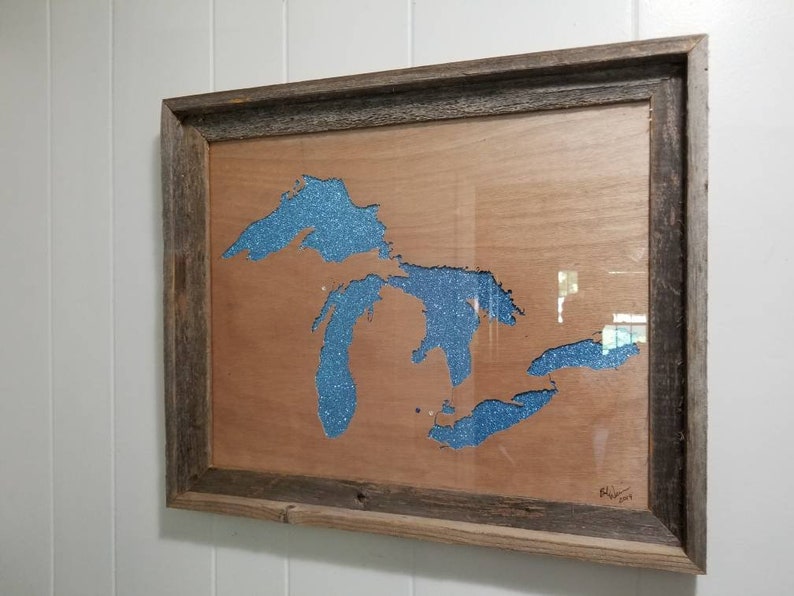 Woodcut of the Great Lakes Hand cut carving of the Great Lakes Scroll sawn woodcut of the Great Lakes.