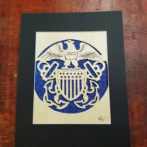 U.S.Navy Insignia.  Woodcut of U.S. Navy insignia. Hand cut wood carving U.S. Navy emblem.