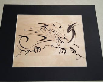 Dragon on the Rocks, woodcut. Scroll saw wood cut of a dragon on rocks