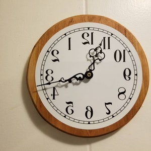 Barber Shop clock. Can be read easily looking through a mirror. Reverse clock. Very unique Conversation Piece.