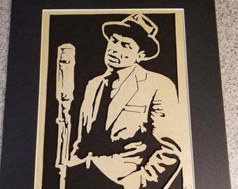 Old Blue Eyes,  Frank Sinatra wood cut, portrait of Frank Sinatra singing at the mic. Scroll saw wood cut of Frank Sinatra