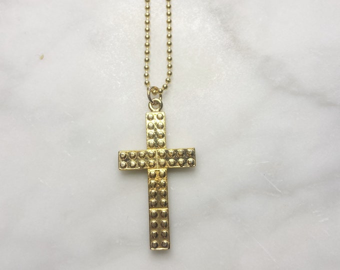 Gold building block cross necklace