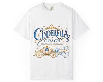 May include: A white short-sleeve t-shirt featuring a graphic print with the text "Cinderella Coach Limousine Company" in blue and gold. The design includes a golden crown, a horse-drawn carriage, and a white horse surrounded by small gold stars.