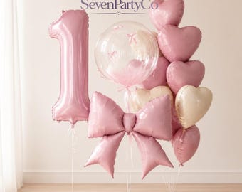 Juego de globos rosas con números y lazos de burbujas para fiestas de cumpleaños.