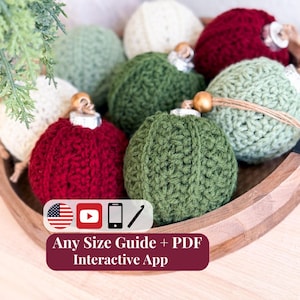 May include: A collection of round, crocheted ornaments in shades of cream, sage green, forest green, and deep red. Each ornament features a textured cable-knit pattern, a silver cap, and a wooden bead on a twine loop. Text reads: Any Size Guide + PDF Interactive App.