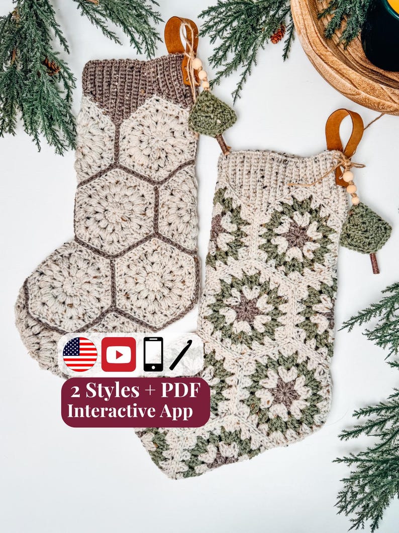 May include: Two crochet Christmas stockings featuring hexagonal motifs in cream, brown, and sage green yarn. Each stocking has a leather hanging loop, wooden beads, and a small crochet charm. Text on the image reads: 2 Styles + PDF Interactive App.