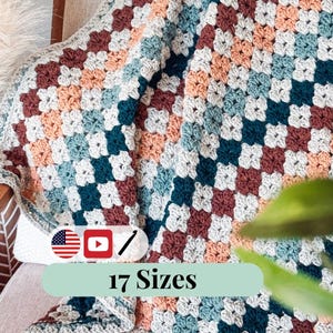 May include: A handmade crochet blanket in a granny square pattern. The blanket features squares in shades of white, teal, peach, and burgundy. The blanket is draped over a chair. Text on the image reads "17 Sizes".