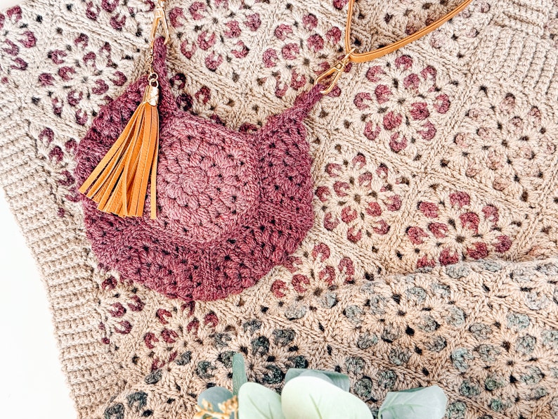 A handmade crocheted purse with a tassel, perfect for a unique gift or vintage fashion accessory.