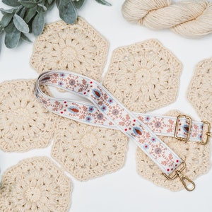 A unique handmade gift featuring a crocheted lanyard adorned with eucalyptus leaves.