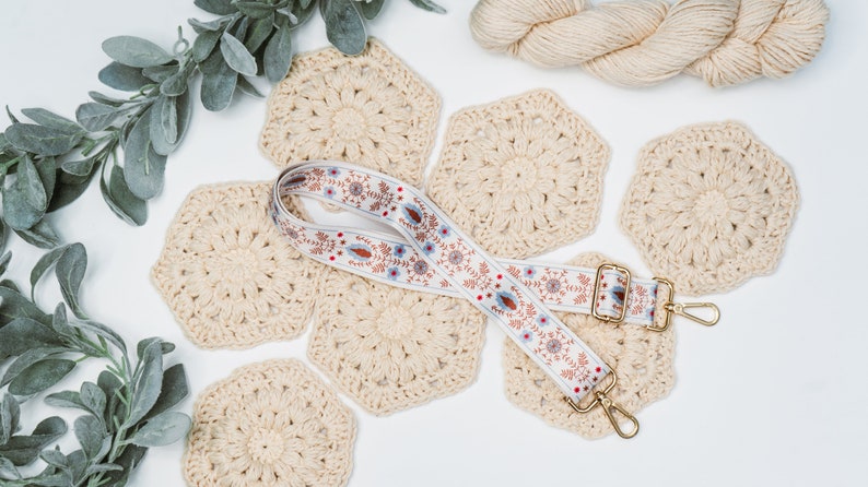 A unique handmade gift featuring a crocheted lanyard adorned with eucalyptus leaves.
