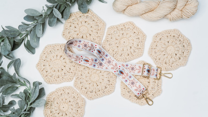 A unique handmade gift featuring a crocheted lanyard adorned with eucalyptus leaves.