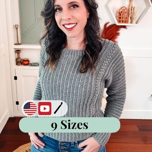 May include: A grey, textured crochet sweater with long sleeves. The image includes a text overlay that reads "9 Sizes" and features the American flag, a YouTube play button, and a crochet hook icon.