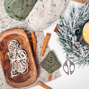 May include: A set of three ceramic mugs with a speckled, matte finish. The mugs are in shades of cream, light gray, and dark gray. Each mug has a simple, minimalist design, perfect for coffee or tea.
