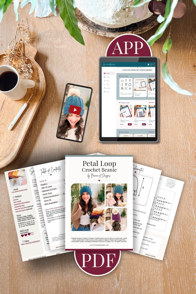 Crochet beanie pattern PDF pages, a phone showing the video tutorial, and a tablet showing the app on a wooden table