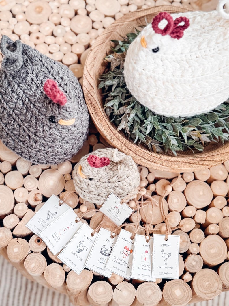 Gray, white, and oatmeal crochet chickens seen from above with a row of printable chicken gift tags