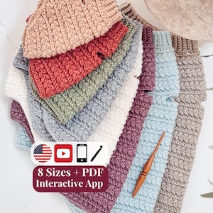 May include: A stack of crocheted garments in various colors including beige, red, green, white, purple, and light blue, accompanied by a wooden crochet hook. A label displays the text 8 Sizes + PDF Interactive App with icons.