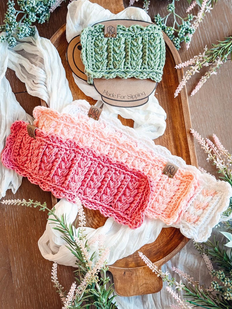 May include: A collection of handmade crochet headbands in shades of pink, white, and green, arranged on a wooden tray. The headbands feature a textured, ribbed design and are adorned with small leather tags. The text "Made For Sipping" is visible.