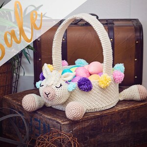 A llama crochet easter basket with a handle in bright colors.