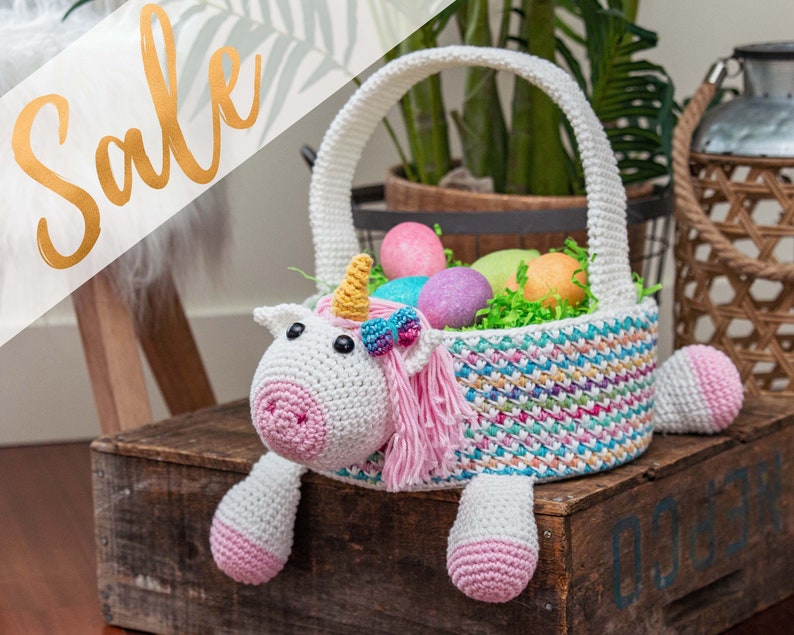 A unicorn crochet easter basket with a handle in bright colors.