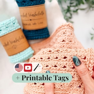 May include: Three crocheted washcloths in teal, light mint, and peach colors. Two washcloths are rolled and secured with brown paper bands labeled Crochet Washcloth. The third peach washcloth is held open to show the textured openwork stitch pattern.