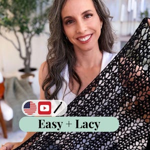 Smiling woman holds up a black lacy crochet piece—perfect as a handmade gift or to pair with vintage clothes. Text overlay reads "Easy + Lacy" with USA flag, YouTube, and pencil icons. Indoor setting with plants in the background.