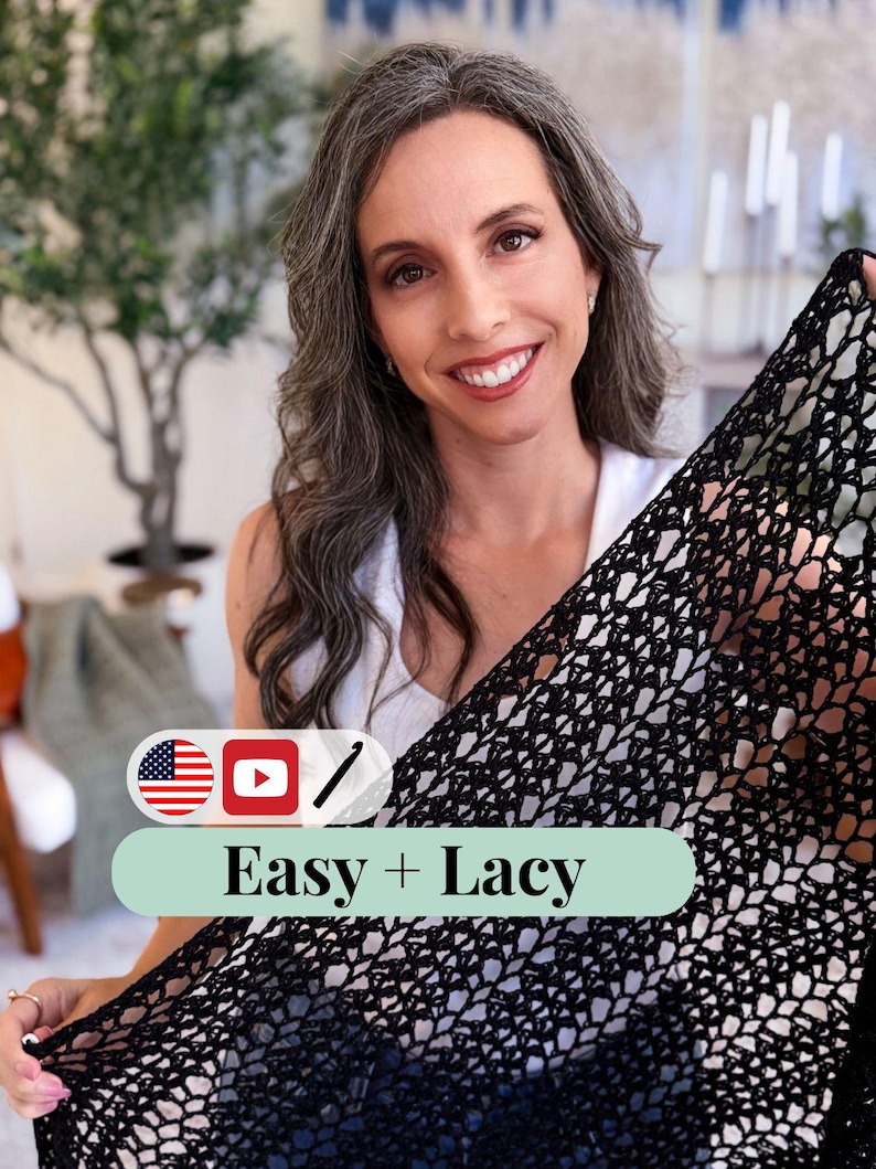 Smiling woman holds up a black lacy crochet piece—perfect as a handmade gift or to pair with vintage clothes. Text overlay reads "Easy + Lacy" with USA flag, YouTube, and pencil icons. Indoor setting with plants in the background.