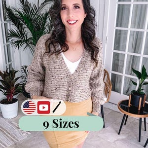 May include: A woman wearing a beige cardigan over a white top and a yellow skirt. The cardigan has a button-up front and a textured knit design. The image includes the text "9 Sizes".