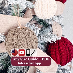 May include: Three round crochet ornaments in cream, tan, and dark red hanging on a tree. A white rectangular label features icons of a flag, YouTube play button, smartphone, and crochet hook, with the text Any Size Guide + PDF Interactive App.