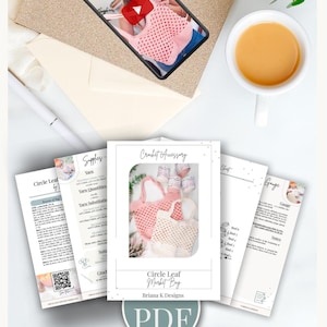 A crochet pattern PDF for a pink mesh bag is displayed with sample pages fanned out, an envelope, a cup of coffee, and a tablet showing a woman holding the finished bag—perfect as a handmade gift or accessory for modern clothes lovers.