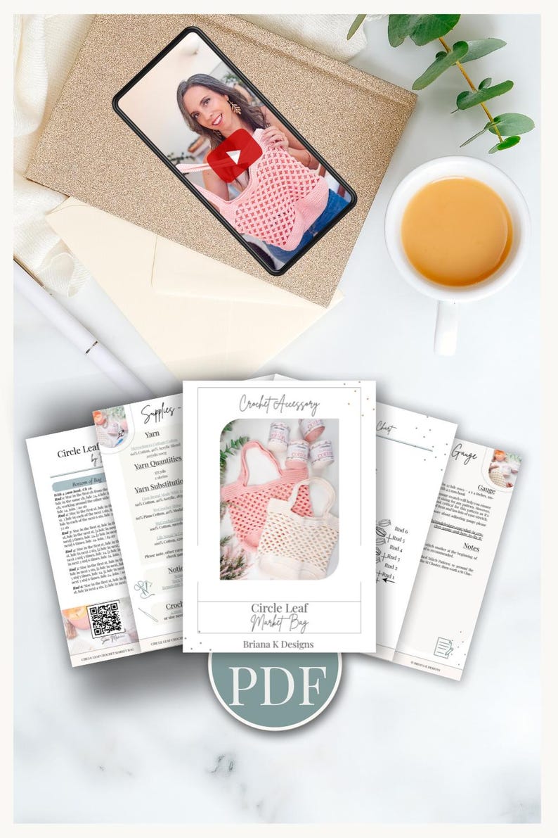 A crochet pattern PDF for a pink mesh bag is displayed with sample pages fanned out, an envelope, a cup of coffee, and a tablet showing a woman holding the finished bag—perfect as a handmade gift or accessory for modern clothes lovers.