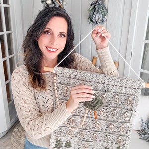 May include: A rustic wooden sign with the text "Welcome to our home" in white lettering. The sign features a distressed finish and a simple, inviting design, perfect for front door decor.