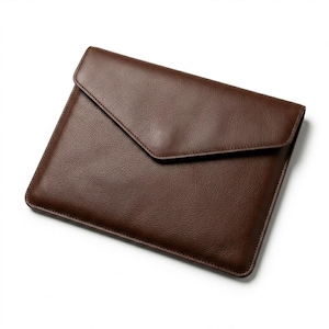 May include: A dark brown leather envelope-style sleeve with a textured surface and a pointed flap closure. The rectangular case features stitched edges and a smooth, clean design, providing a secure and protective storage solution for documents.