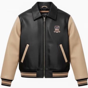 May include: A black jacket with tan sleeves, a full-length front zip, and a classic collar. The garment features two side pockets with tan trim, ribbed cuffs and hem with tan stripes, and an Avirex logo patch on the upper left chest area.