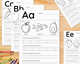 May include: A set of educational alphabet worksheets featuring black and white line drawings of objects like an apple, aeroplane, avocado, banana, carrot, squirrel, strawberry, earth, and elephant, accompanied by a yellow pencil and colourful crayons.