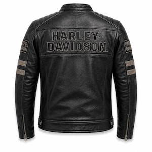 May include: A black leather jacket featuring the text HARLEY-DAVIDSON embossed across the upper back. The jacket includes quilted shoulder detailing, two horizontal grey stripes on each sleeve, and patches on the upper arms with text.