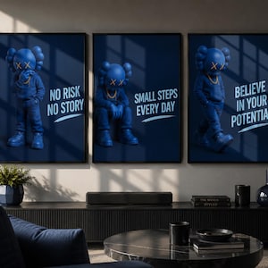 May include: A set of three dark blue wall art prints featuring a stylized blue character with X-shaped eyes. The prints display the text NO RISK NO STORY, SMALL STEPS EVERY DAY, and BELIEVE IN YOUR POTENTIAL in a light blue font against a dark background.